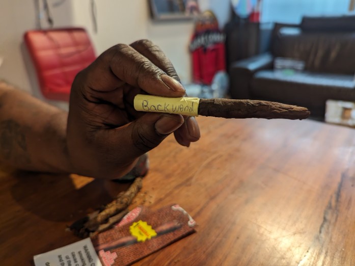 image of mac showing his completed homemade rolled blunt